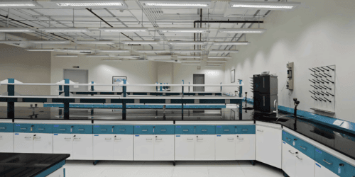 Home page laboratory furniture setup featuring modular workstations, integrated storage cabinets, and pegboard panels for efficient glassware drying and lab organization.