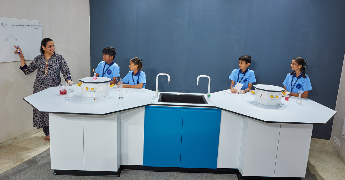 School laboratory furniture setup with student workbenches, storage units, and safety features designed for science education environments.